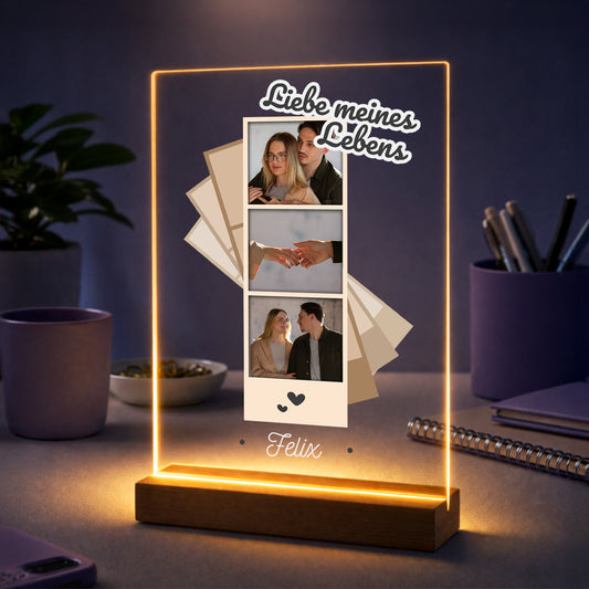 Personalisiertes Acrylglasbild mit Fotostreifen und dem Schriftzug Liebe meines Lebens